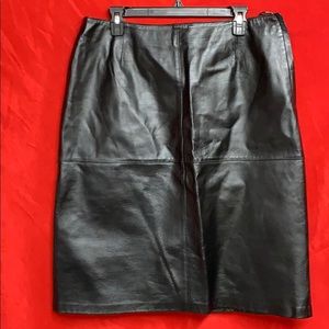 Beautiful sleek black leather skirt. 25.5” long.